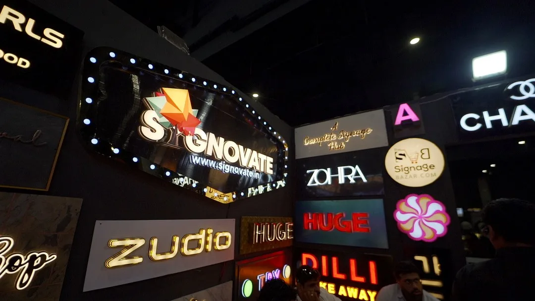 Signage display wall with illuminated brand boards